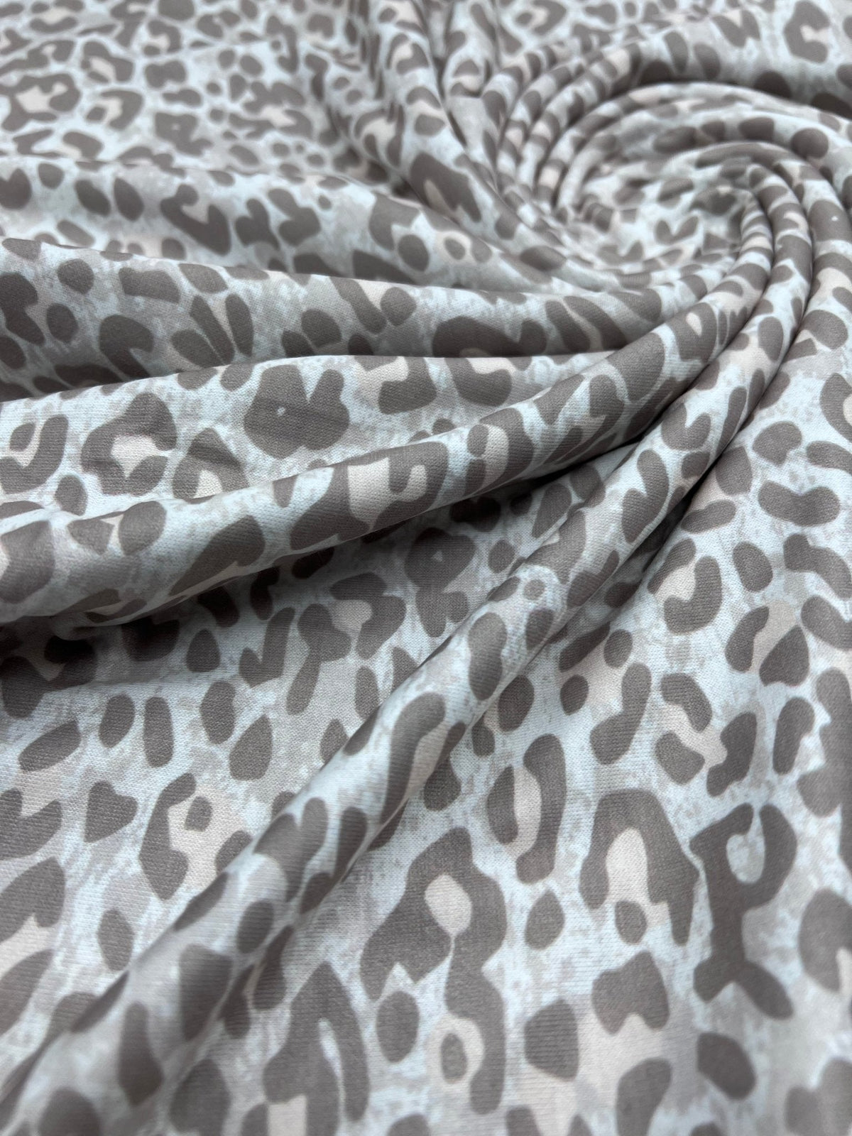 Pale Fade Animal Print Spun Poly Stretch Fabric