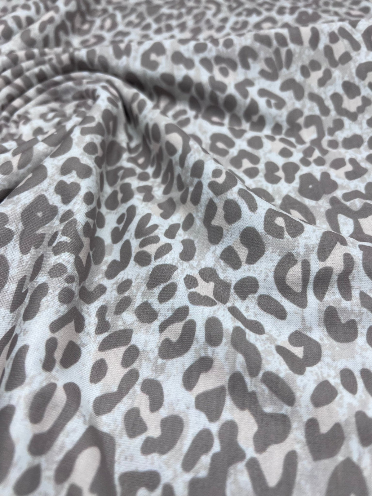 Pale Fade Animal Print Spun Poly Stretch Fabric