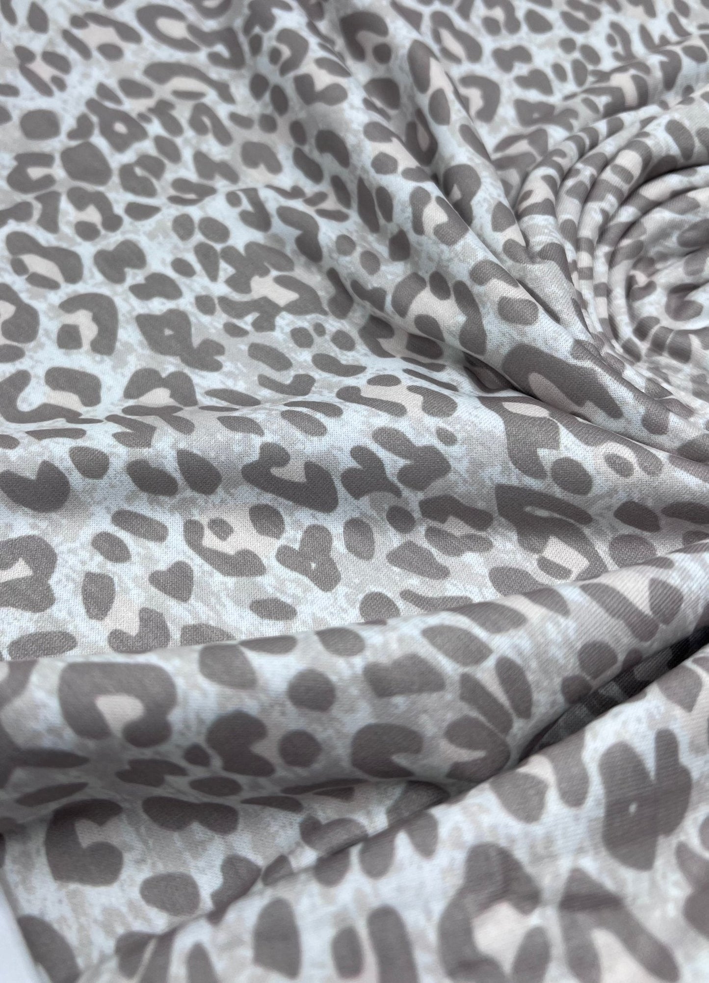 Pale Fade Animal Print Spun Poly Stretch Fabric