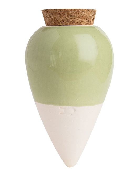 Pepin Olla with sage green glazed top, white base and cork stopper on a plain background