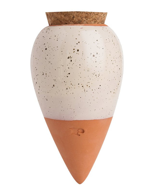 Pepin Olla with speckled white glazed top, terracotta base and cork stopper on a plain background