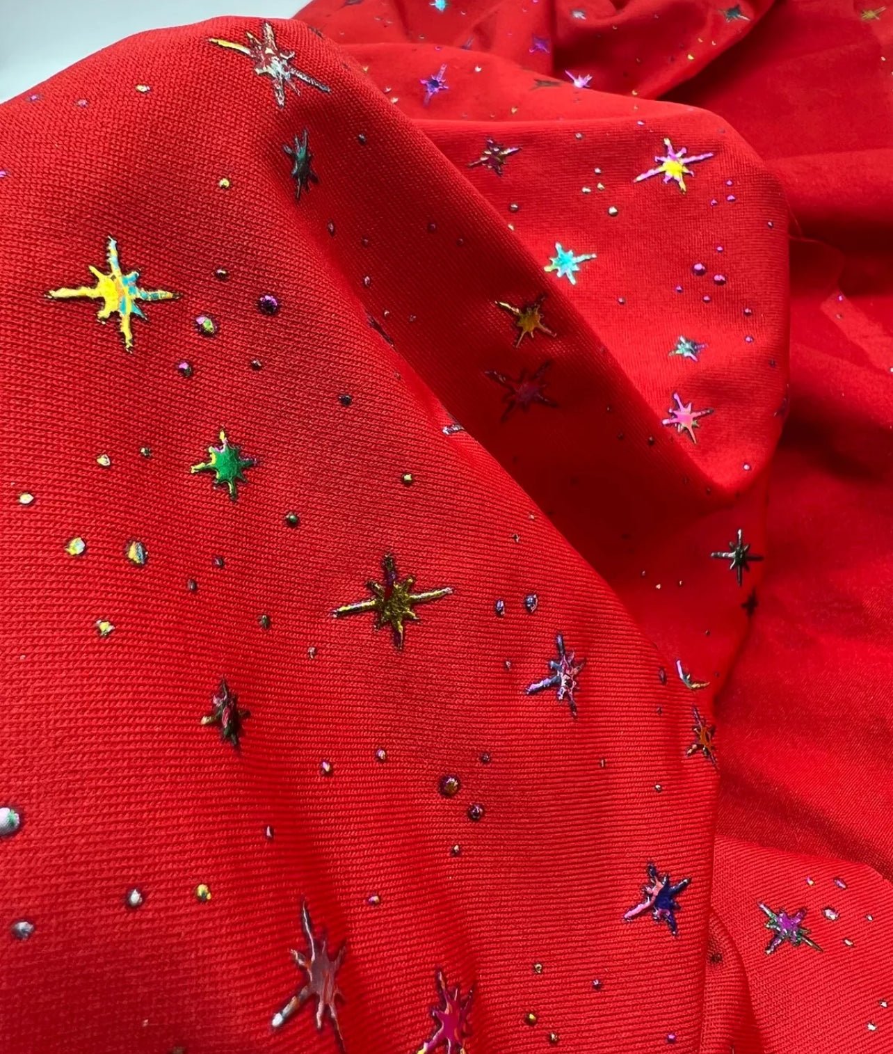 Red Multi Star Soft Spun Poly Stretch Fabric