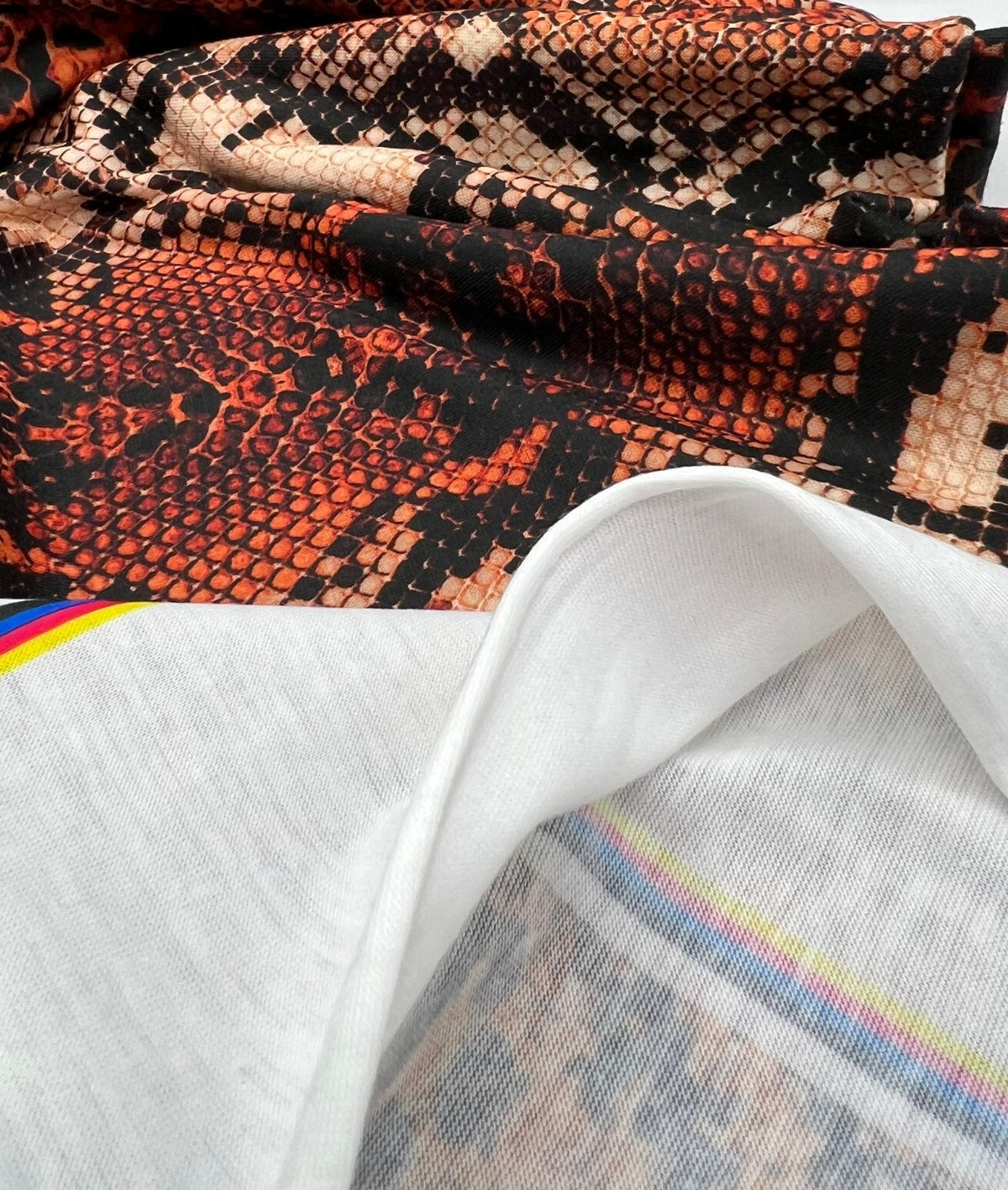 Rust Snake Print Spun Poly Stretch Fabric