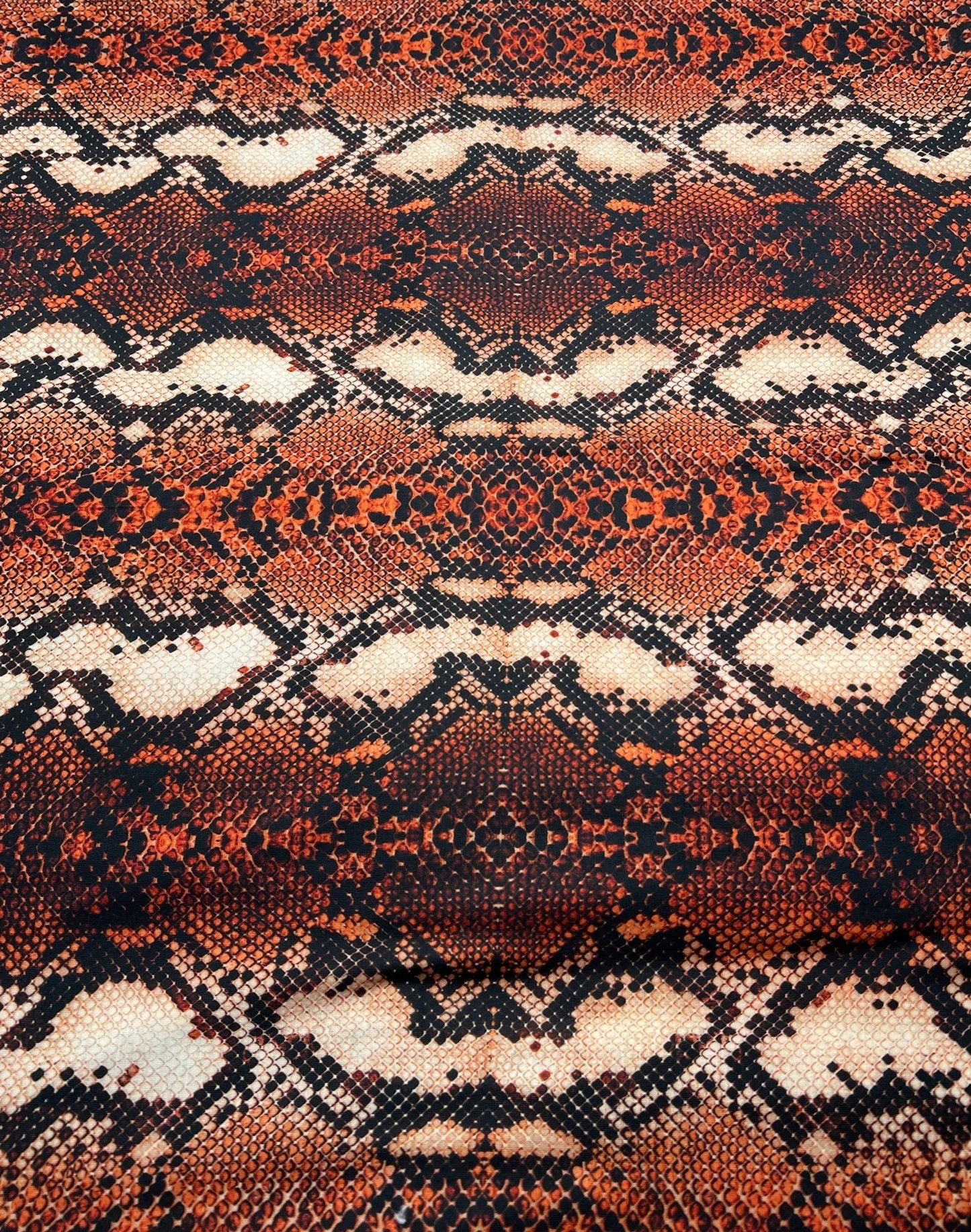 Rust Snake Print Spun Poly Stretch Fabric