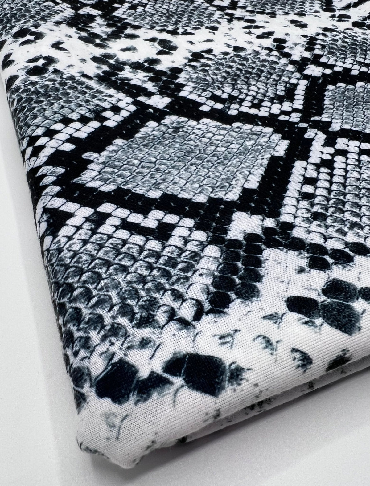Silver Grey Snake Print Spun Poly Stretch Fabric