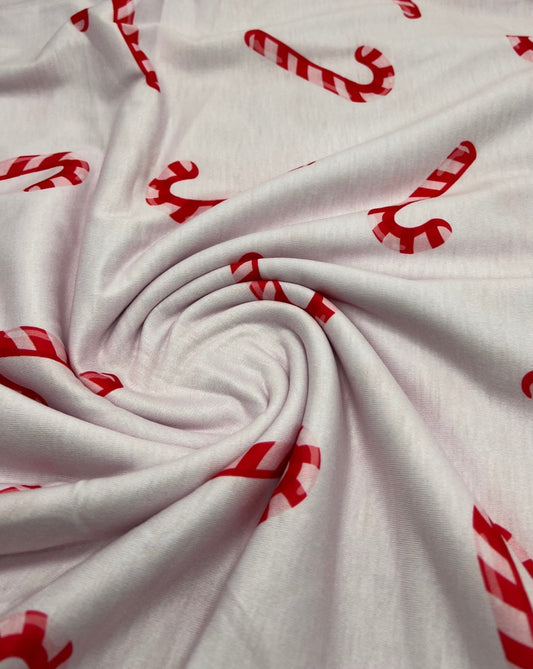 Soft Pink Candy Cane Print Soft Spun Poly Stretch Fabric