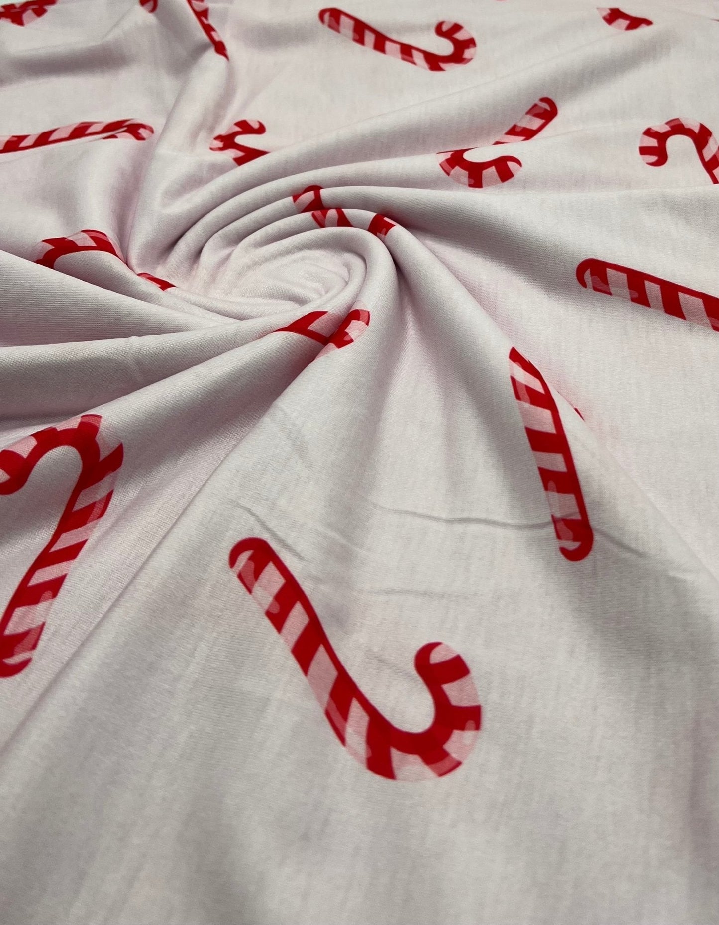 Soft Pink Candy Cane Print Soft Spun Poly Stretch Fabric