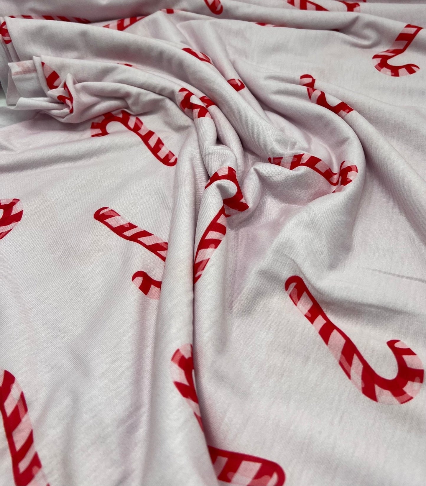 Soft Pink Candy Cane Print Soft Spun Poly Stretch Fabric