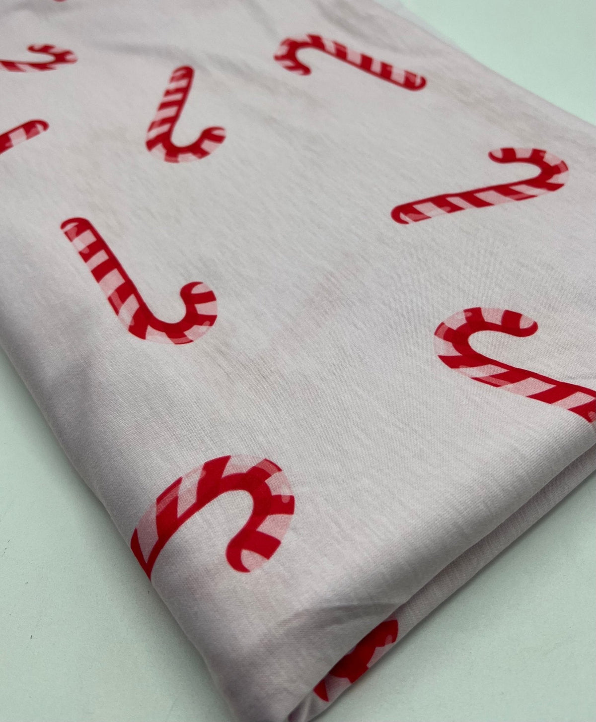 Soft Pink Candy Cane Print Soft Spun Poly Stretch Fabric