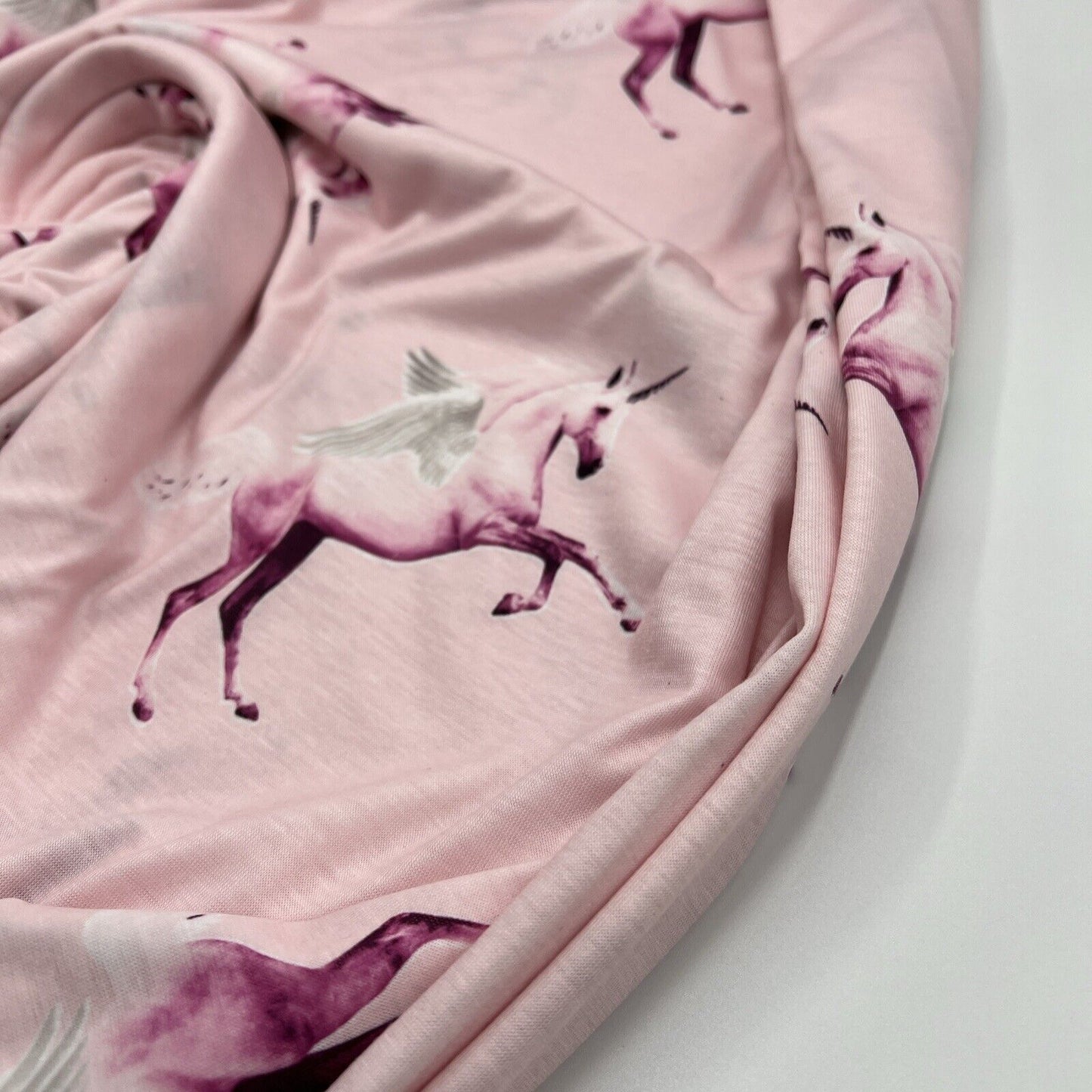 Soft Pink Unicorn Print Spun Poly Stretch Fabric