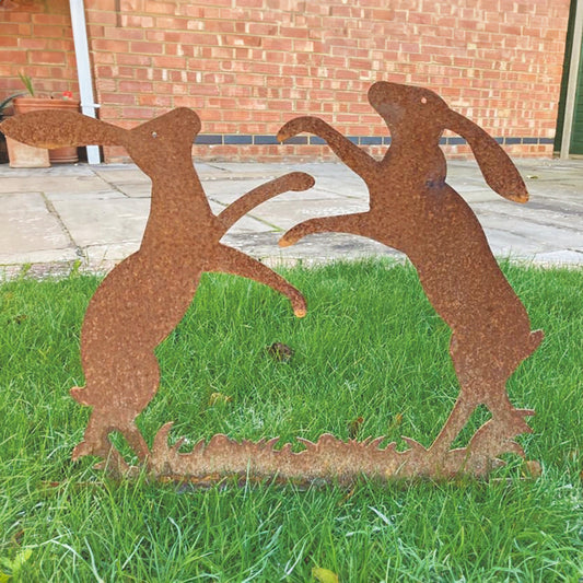 PoppyForge Large Boxing Hares On Grass