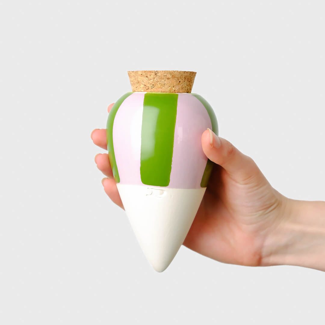 Pepin Olla with green and lilac stripes, held in the hand