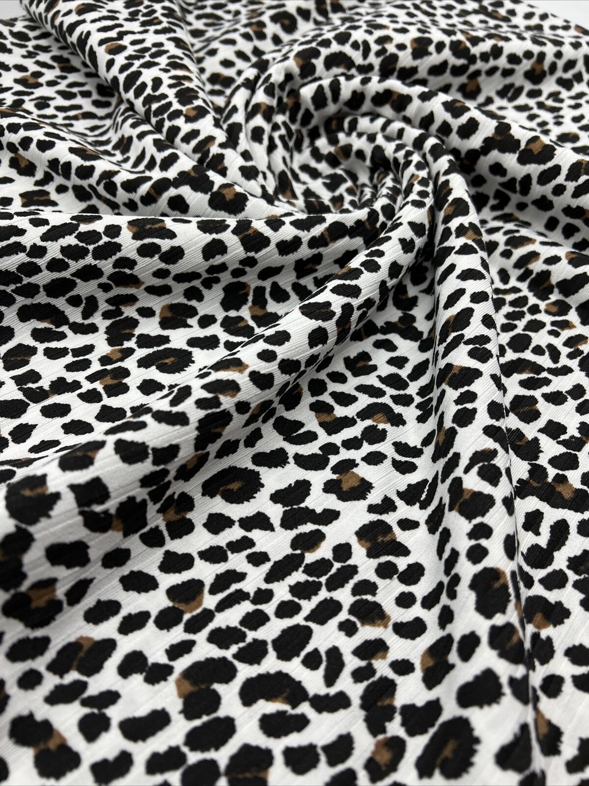 White Leopard Print 8x4 Wide Rib Stretch Fabric