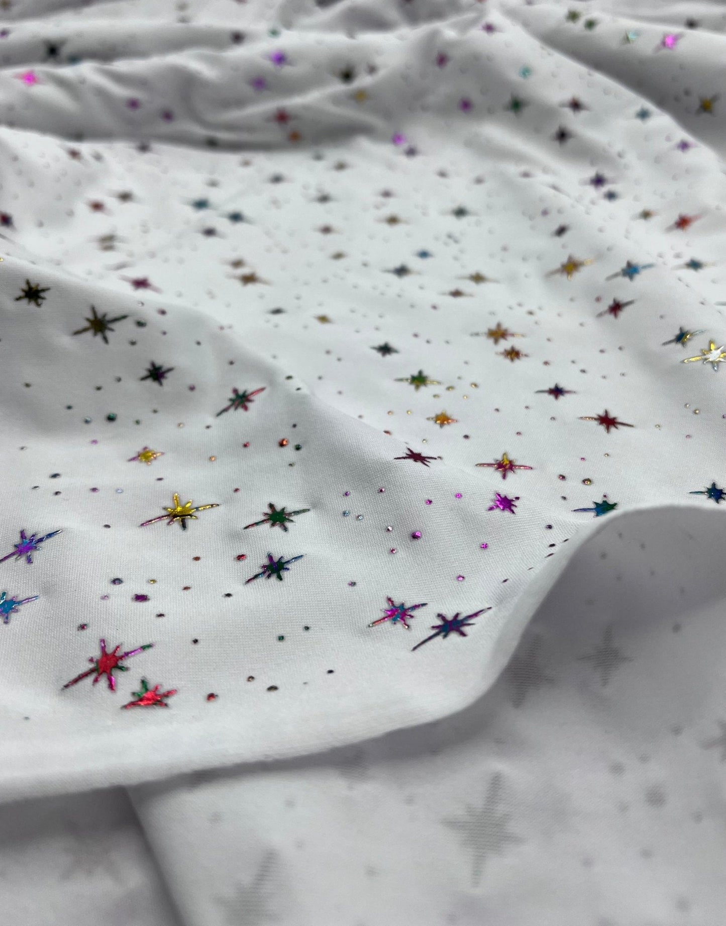 White Multi Star Soft Spun Poly Stretch Fabric
