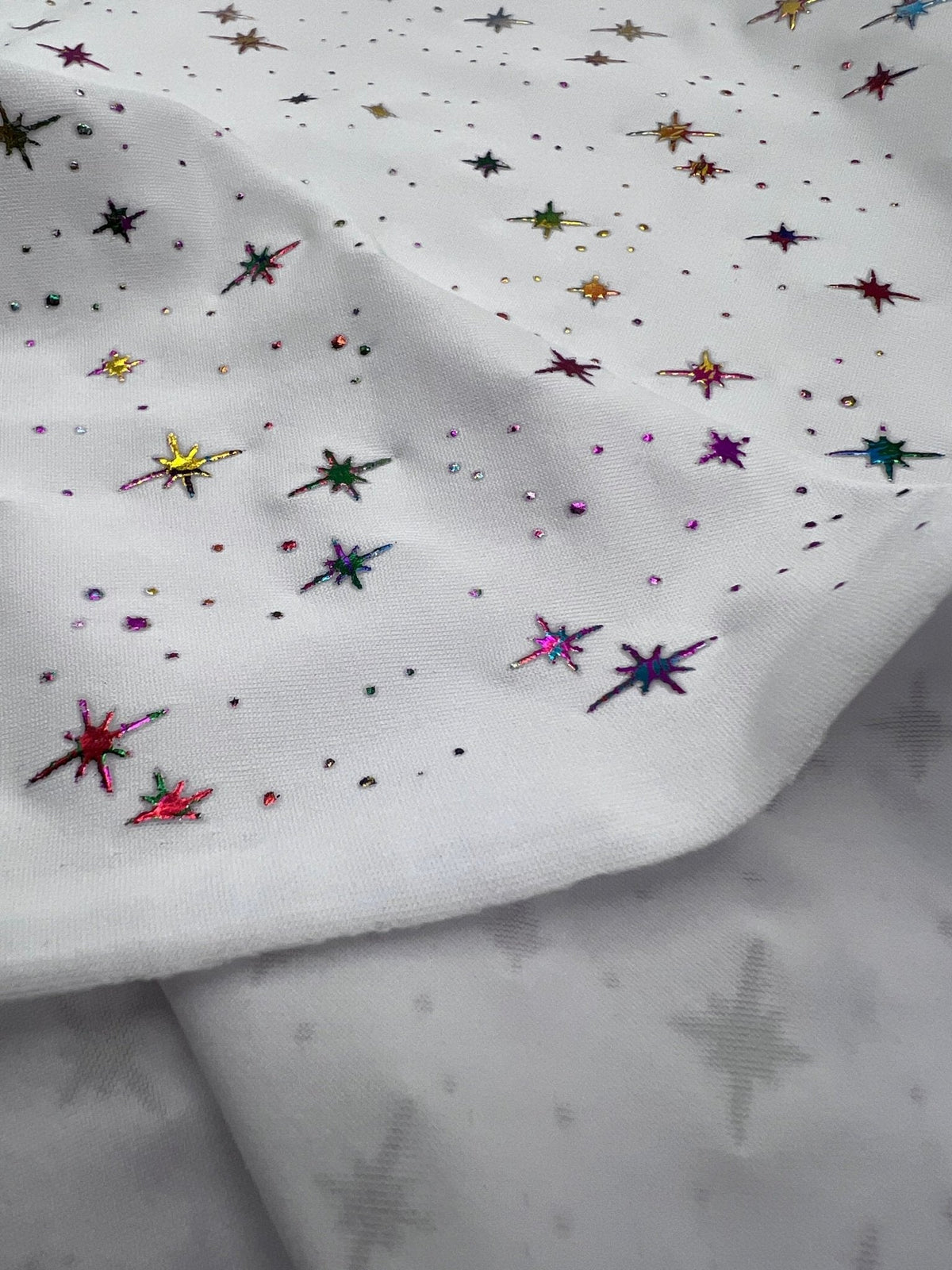 White Multi Star Soft Spun Poly Stretch Fabric