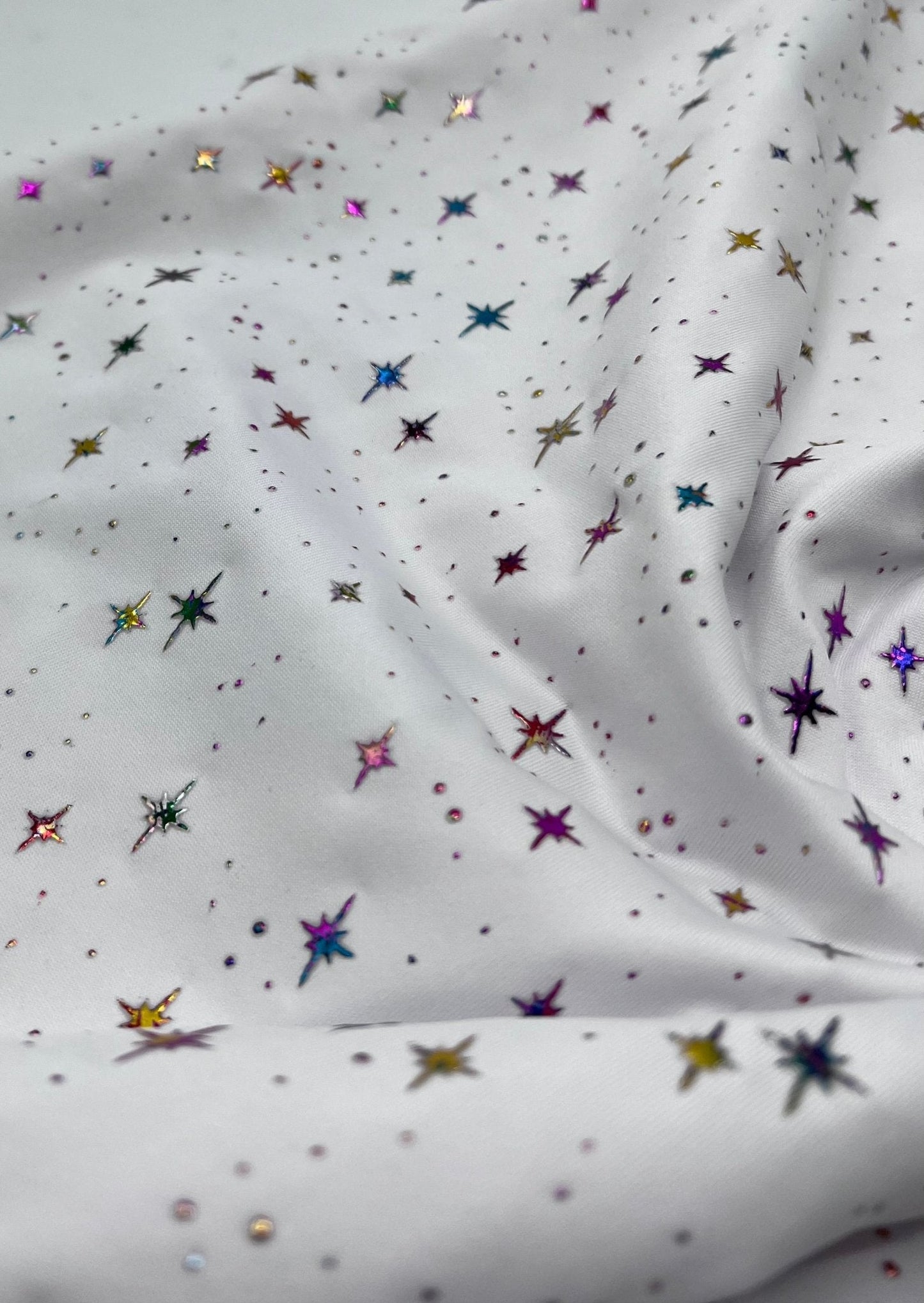 White Multi Star Soft Spun Poly Stretch Fabric