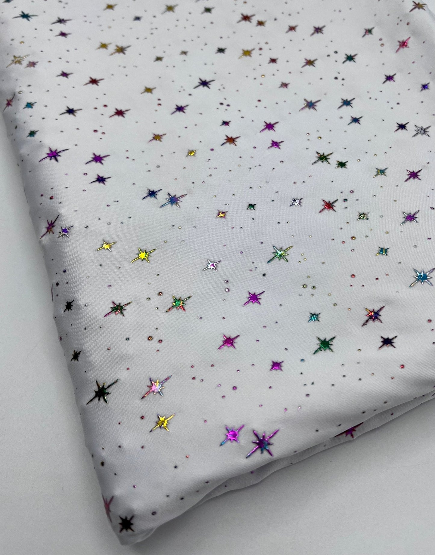 White Multi Star Soft Spun Poly Stretch Fabric