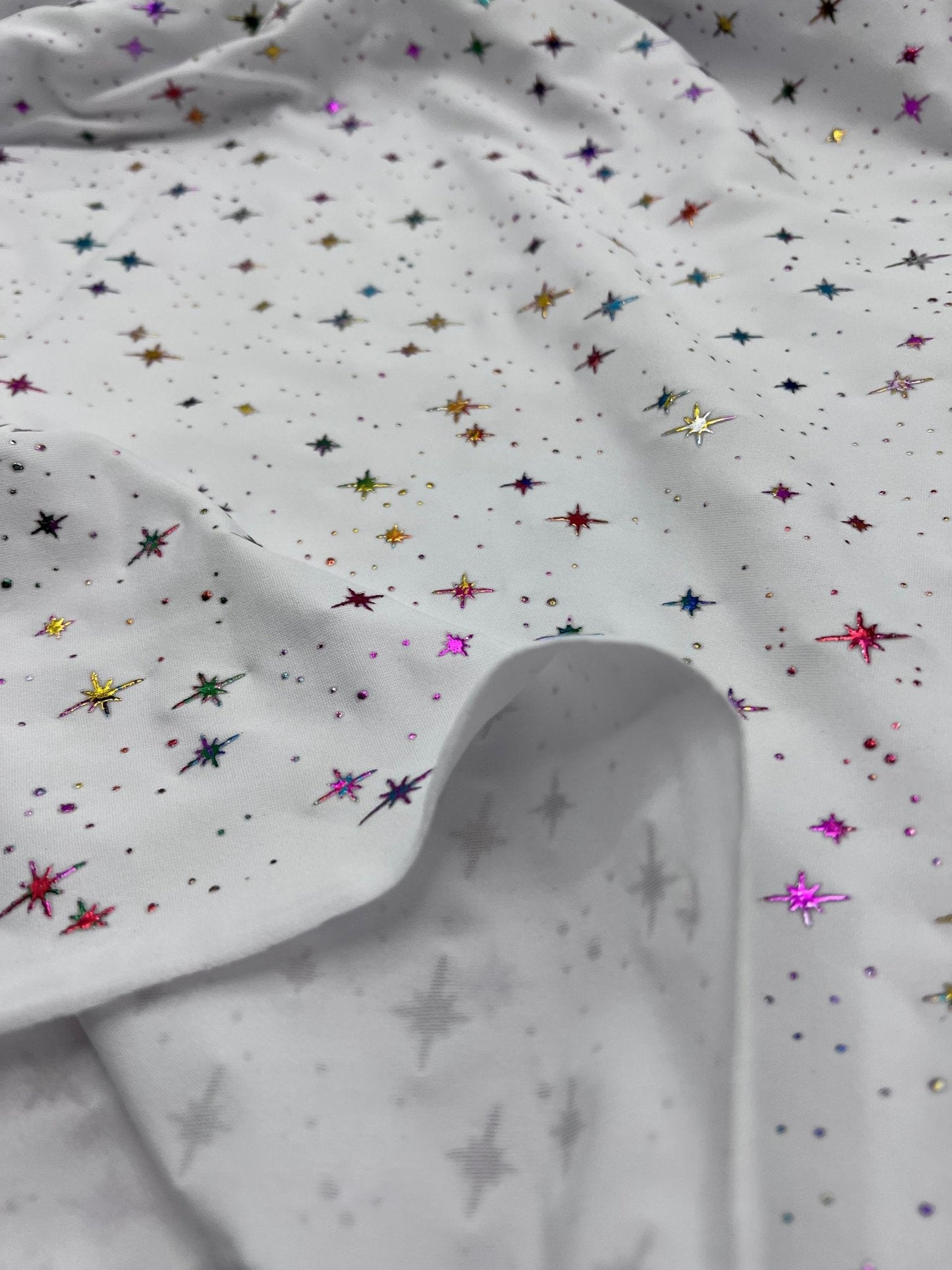 White Multi Star Soft Spun Poly Stretch Fabric
