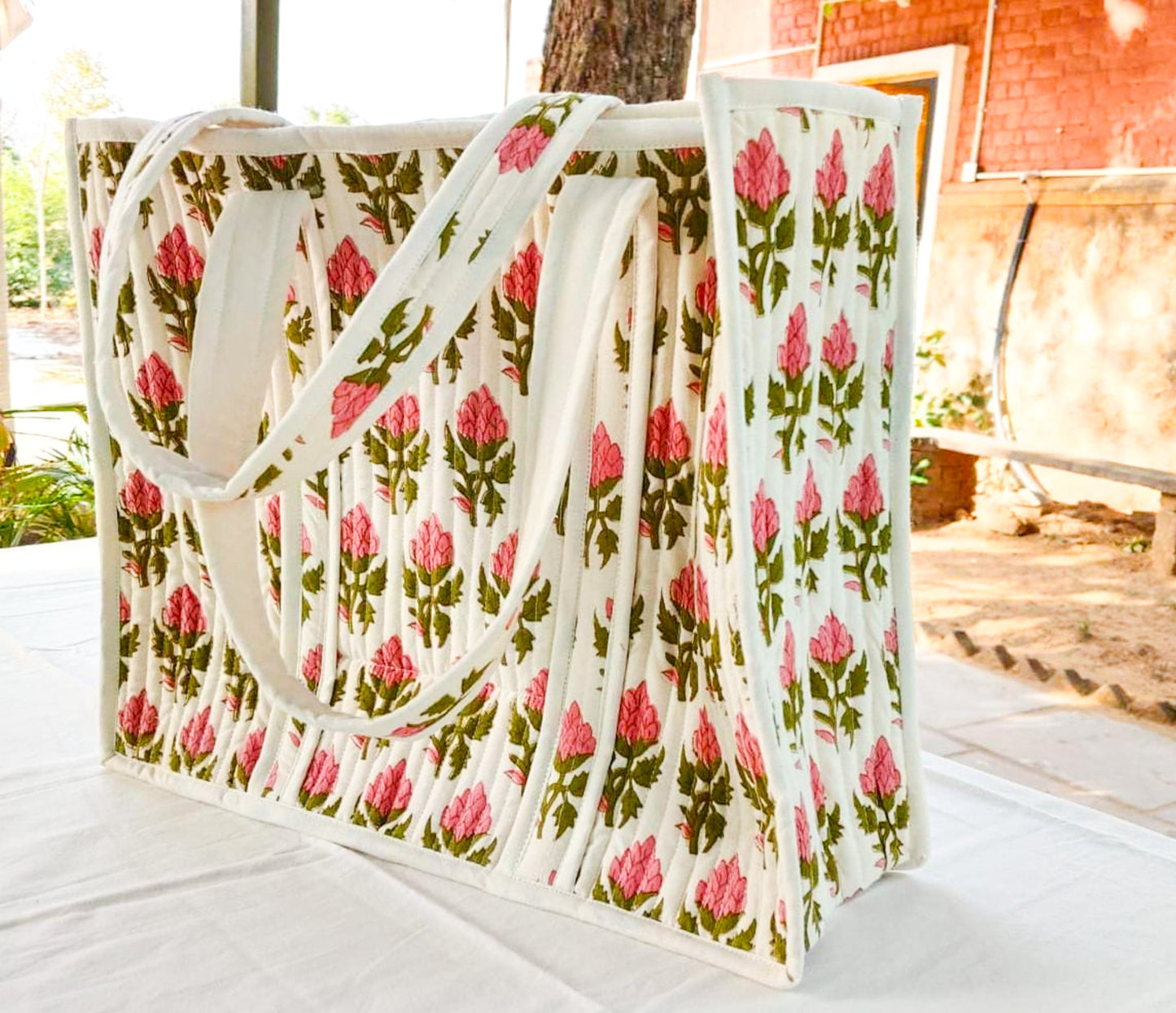Large quilted weekend tote bag, vibrant pink block print, floral design